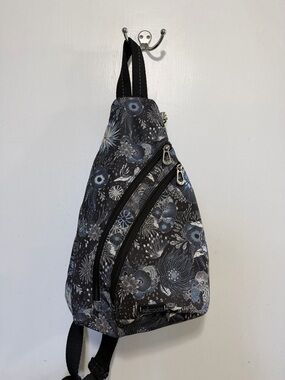 Sakroots Black Floral Sling Backpack